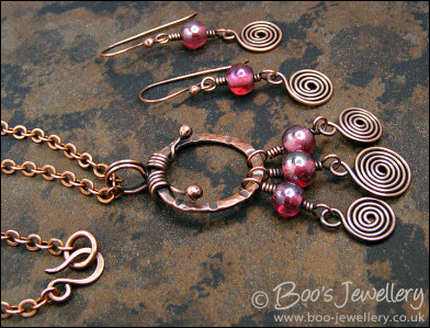 Pink glass and copper spirals necklace and earring set