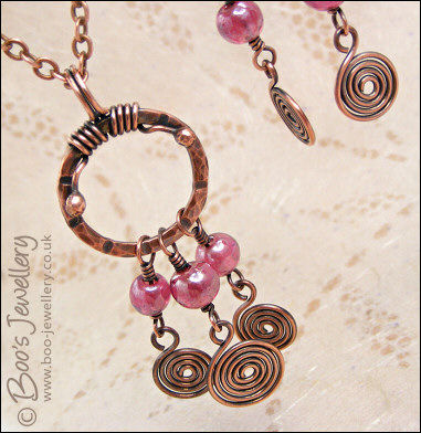 Pink glass and copper spirals necklace and earring set