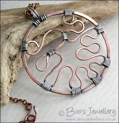 RESERVED - Copper circle pendant with Sterling silver wrapped details