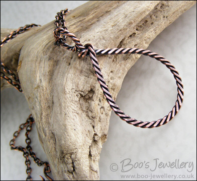 Antiqued copper knotted rope loop pendant on chain