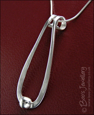Sterling silver teardrop pendant with pebble of silver
