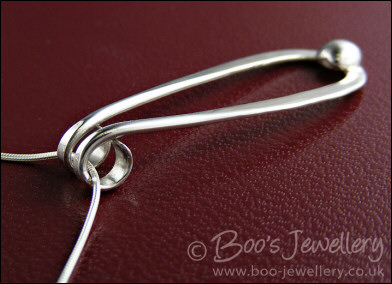 Sterling silver teardrop pendant with pebble of silver