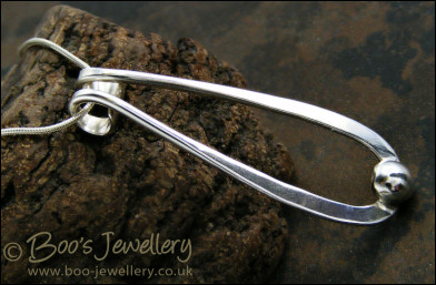 Sterling silver teardrop pendant with pebble of silver