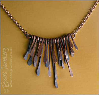 Hammered and antiqued copper paddles necklace