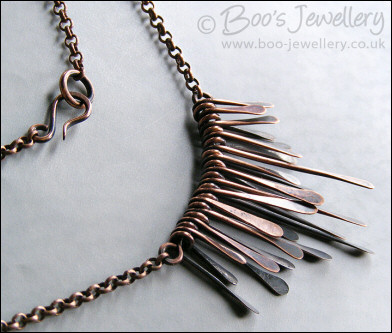 Hammered and antiqued copper paddles necklace