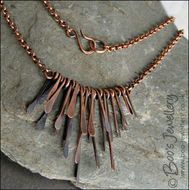 Hammered and antiqued copper paddles necklace