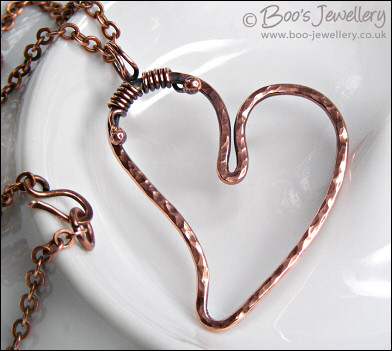 Hammered copper heart pendant with tendril bail