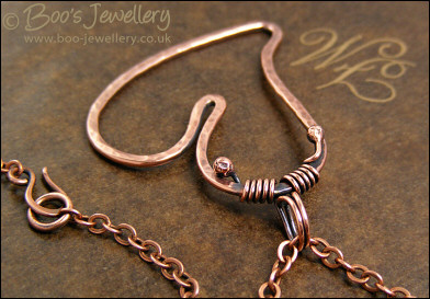 Hammered copper heart pendant with tendril bail
