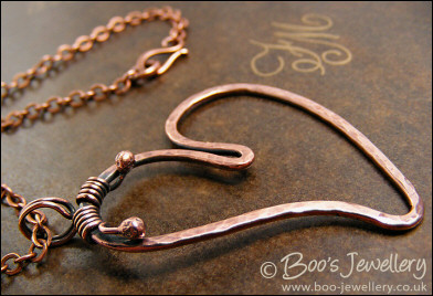 Hammered copper heart pendant with tendril bail