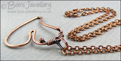 Hammered copper heart pendant with tendril bail