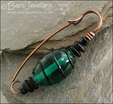Green and black antiqued copper kilt pin
