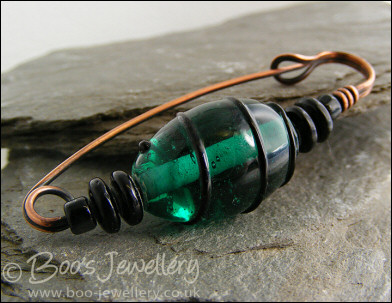 Green and black antiqued copper kilt pin
